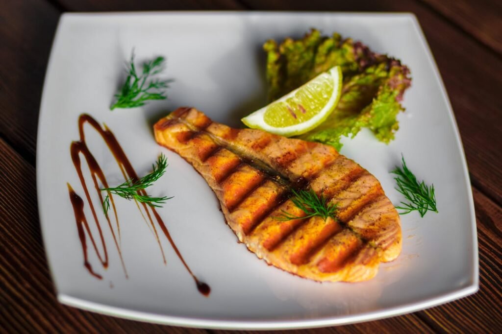 5 Delightful Food Recipes for an Unforgettable Meal - Lemon Herb Grilled Salmon